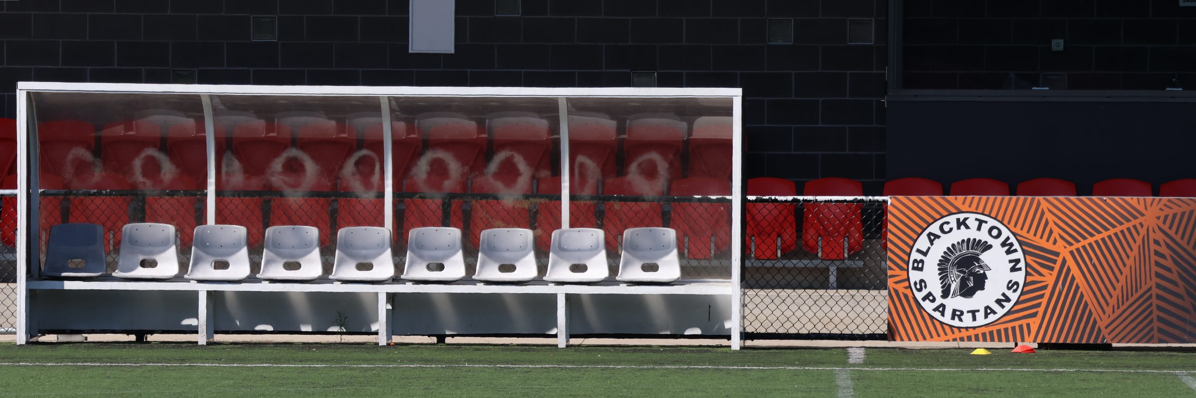Team dugout and Blacktown Spartans crest at Blacktown Football Park