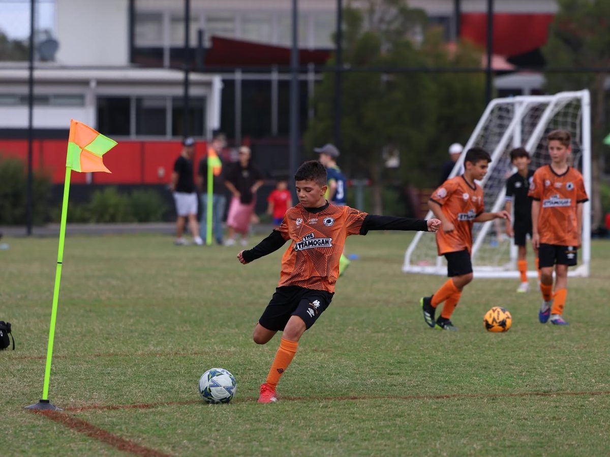 Blacktown Spartans Mixed JDL player striking the ball from a corner
